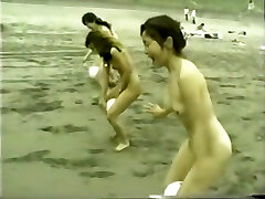 chinese nude girls ball playnig on the beach