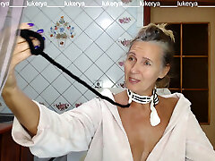 Torrid hostess Lukerya in the kitchen in a dressing gown.