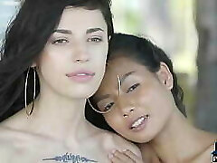 Small Asian and Russian teen lesbians outdoor posing