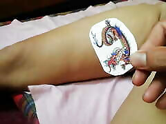 dragon tattoo on thigh near pussy