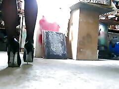 Stiletto high heels scretching on the dusty floor