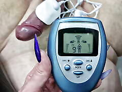 CBT, games with electricity. Dominatrix Nika connected an electrostimulator to the cock and balls of her BDSM slave.