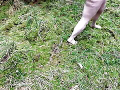 Complete naked girl in the woods and whipping her body and genitals
