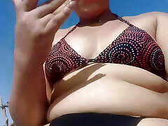 Big ass slow video Latina is very horny and ends up masturbating on the beach, sand and sun
