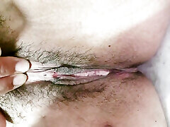 Fingering and rubbing masturbate hairy wet pussy close up with creampie
