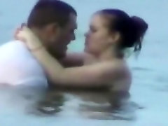 Voyeur tapes a horny couple having kyle summer in the sea