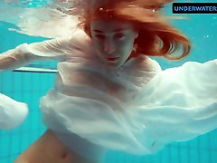 Redhead Diana hot and horny in a white dress