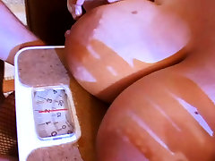 Her huge natural tits gets weighed at 10kg