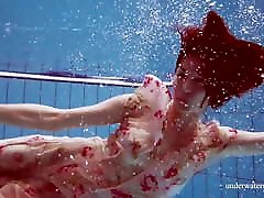 Dressed Croatian cutie Martina swims and strips