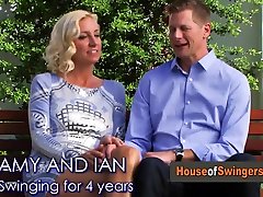 Swinger amateur couple warms up with a sex performance in their bedroom