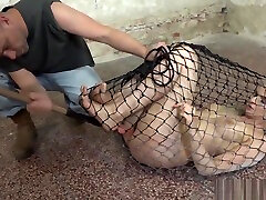 BDSM slave toyed by maledom while restrained