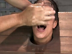 Blowing masters cock tanned brunette is locked in stocks and cuffed